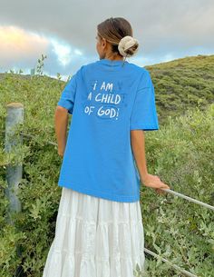 “But to all who did receive him, who believed in his name, he gave the right to become children of God." -John 1:12   Size:   Model is 5'8" and wearing a size Small.    Fit:  Oversized, Unisex Fit Color:  Electric  Blue  Composition:  100% Cotton Features:  Super Soft, Pre-Shrunk Youth Group Outfits, Youth Group Outfit, Christian Outfits, Christian Camp, Elevated Faith, Faith Tshirts, Summer Youth, Christian T Shirts, Child Of God