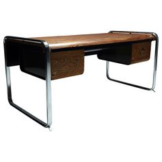 a wooden desk with metal legs and a wood top on the bottom, against a white background