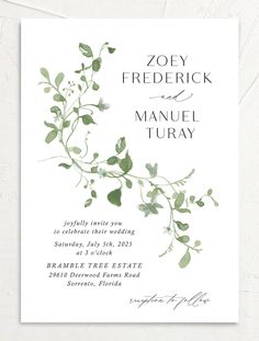 a wedding card with greenery on it