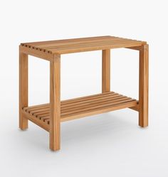 a wooden bench with slatted sides on an isolated white background for use as a side table