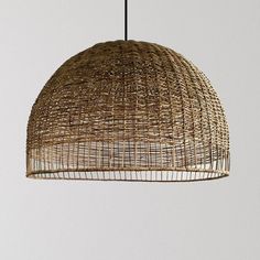 a light that is hanging from the ceiling with some kind of wicker on it