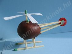 an apple on a wooden stand with two arrows sticking out of it