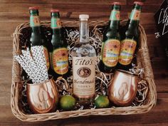 a basket filled with lots of bottles of alcohol