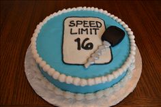 a cake that has been decorated with a speed limit sign on it and is sitting on a table