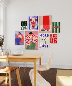 a dining room table with white chairs and art on the wall behind it in an apartment