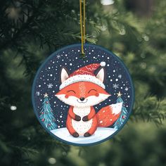 a christmas ornament with a red fox wearing a santa hat on it's head