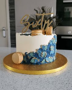 a blue and white cake sitting on top of a counter