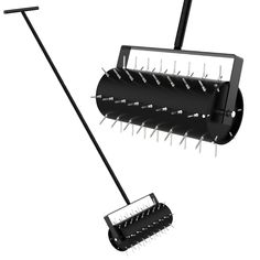 a black and white photo of a broom with spikes attached to the back of it