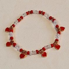 Red & White Stretchy Adjustable Beaded Bracelet With Mini Gold Plated Red Enamel Hearts. Red White Bracelet, Red And White Beaded Bracelet, Adjustable Beaded Bracelet, Beige Bracelet, Fossil Bracelet, Colorful Bead Bracelets, Red Beaded Bracelet, Twisted Bangle, Red Bracelet