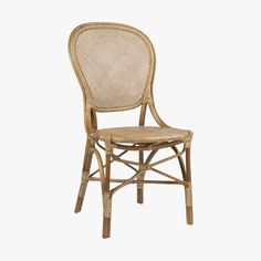 a wicker chair on a white background with the seat upholstered in rattan