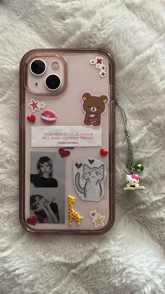 an iphone case with pictures and stickers on it