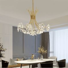 a dining room table with chairs and a chandelier hanging from the ceiling over it