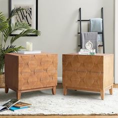 two wooden chests sitting on top of a rug