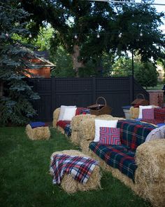 hay bales are stacked on top of each other in the yard