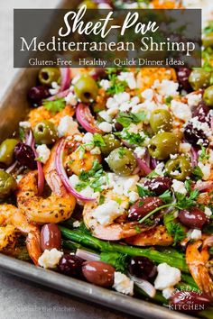 sheet pan mediterranean shrimp salad with olives, feta cheese and red onions on top