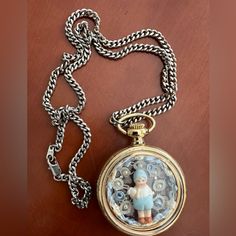 New Handcrafted Gold Tone Pocket Watch Pendant Necklace On Silver Tone Chain. Features Charming Little Boy Holding Rabbit Accented By Pearls And Lace. New, Excellent Condition. Vintage Silver Stainless Steel Pocket Watch, Timeless Metal Jewelry And Watches For Gifts, Timeless Chain Watches As Gifts, Timeless Metal Jewelry And Watches As Gifts, Metal Chain Watches As Gifts, Metal Chain Watches As A Gift, Handmade Vintage Stainless Steel Jewelry, Vintage Metal Pocket Watch As Gift, Vintage Silver Metal Jewelry And Watches