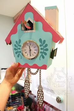 a clock that is hanging from the ceiling