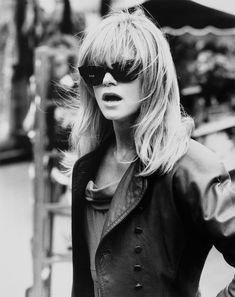 black and white photograph of a woman wearing sunglasses