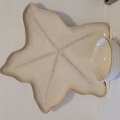 a ceramic dish with a starfish design on it