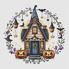 a house with pumpkins and witches on it is in the middle of a frame