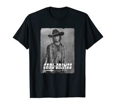 a black t - shirt with an image of a man wearing a cowboy hat and holding a