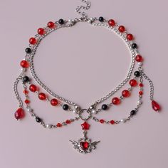 IG: @destellar.shop Gothic silver necklace, princesscore, vampire necklace, dark fairycore aesthetic, whimsigoth fashion. Dark Fairycore Aesthetic, Gothic Grunge Aesthetic, Whimsigoth Fashion, Red And Black Necklace, Gothic Jewelry Diy, Pulseras Kandi, Vampire Necklace, Angel Wings Necklace, Red Gothic