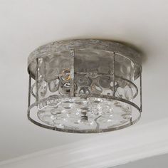 a light fixture hanging from the ceiling in a room