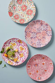 three plates with different designs on them