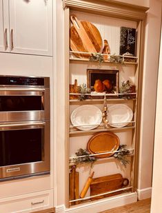 the shelves in the kitchen are filled with cooking utensils