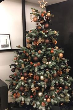 a decorated christmas tree in an office cubicle