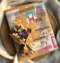 a bouquet of flowers sitting on top of a piece of brown paper with stickers