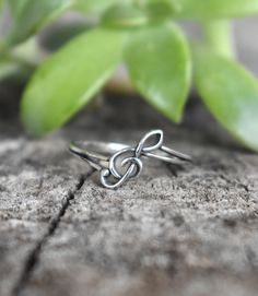 "Treble Clef Ring: - Treble Clef 10mm - 1.4mm smooth round band - .925 solid sterling silver - Available in US ring sizes 4-10.5 with half sizes. All rings here: https://www.etsy.com/shop/AWildViolet?ref=seller-platform-mcnav&section_id=13958646 💜Check out our new \"Ready to Ship\" section for gifts that ship in 1 business day. https://www.etsy.com/shop/AWildViolet?ref=seller-platform-mcnav§ion_id=23587515 Connect with us on Instagram @a_wild_violet for sales and giveaways! **All items are in s Music-themed Band Jewelry Gift, Music-themed Silver Ring As A Gift, Music-themed Silver Rings For Gifts, Music-themed Silver Rings As Gifts, Music-themed Silver Rings For Gift, Silver Music-themed Rings For Gifts, Treble Clef Ring, Nickel-free Music-themed Metal Jewelry, Music Note Ring