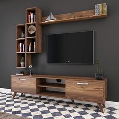 an entertainment center with bookshelves and a television