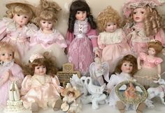 a group of dolls sitting next to each other