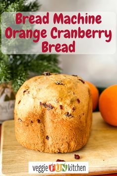 an orange cranberry bread sitting on top of a cutting board