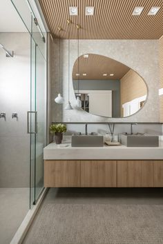 a bathroom with two sinks and a large mirror