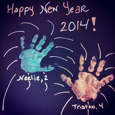 two handprints on a chalkboard with the words happy new year