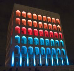 the building is lit up with colorful lights