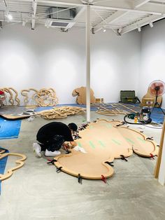 a room filled with lots of wooden toys