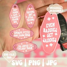 a hand holding a pink keychain that says even baddies get saddles