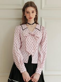 Romantic and unique blouse featuring the striped pattern and heart pattern throughout the blouse. The spread collar and the big ribbon are also accentuated. You can also adjust the silhouette with the strap at waistline. Style with mini skirt, or denim jeans to create lovely looks. - V-neckline with spread collar- Striped and heart pattern throughout- Big ribbon detail at front- Waist string that can adjust the silhouette- Two-button barrel cuffs Chic Doll Collar Tops For Spring, Chic Spring Tops With Doll Collar, Chic Fitted Blouse With Striped Collar, Fitted Blouse With Striped Collar For Spring, Chic Tops With Cute Collar For Spring, Pink Doll Collar Blouse For Spring, Pink Blouse With Doll Collar For Spring, Trendy Pink Blouse With Collar, Trendy Pink Collared Blouse