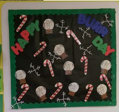 a bulletin board decorated with candy canes and snowmen