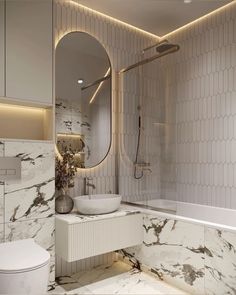 a bathroom with marble walls and flooring is shown in this image, it has a round mirror above the sink