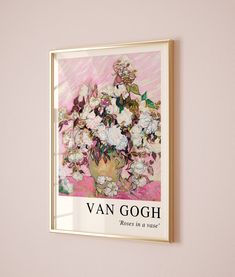 a painting hanging on the wall next to a vase with flowers in it that reads van gogh