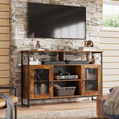 a living room with a large television mounted on the wall