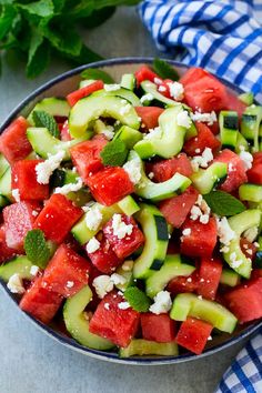 watermelon salad with feta cheese, cucumber and mint in a bowl