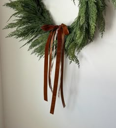 a green wreath hanging on the wall