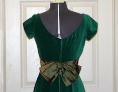 "Vintage 1950s Kay Selig Velvet and Satin party dress. This is truly a fashion for the ages! Colors: Green Style:3020 Size: 12 Measurements: (taken flat) Shoulder to Shoulder: 14\" Bust: 16\" Waist: 14\" Length Shoulder to Hem: 44.25\" Please measure a dress that fits you to use as a size comparison as vintage sizes are smaller that sizes today. Label: Kay Selig New York Care Instructions: Dry Clean Only. Do Not Use Petroleum Solvents or Coin Operated Method of Dry Cleaning. Have any questions? Fitted 1950s Style Dresses For Vintage Events, 1950s Fitted Prom Dresses, Classic Fitted Vintage Dress For Parties, Fitted Green Vintage Party Dress, Fitted Green Vintage Dress For Party, 1950s Fitted Vintage Dress For Party, 1950s Vintage Fitted Dress For Formal Occasions, 1950s Fitted Vintage Dress For Formal Occasions, 1950s Style Fitted Party Dress