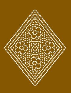 a square pattern with white dots on brown background