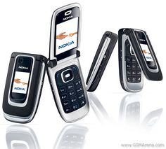 three nokia cell phones sitting next to each other